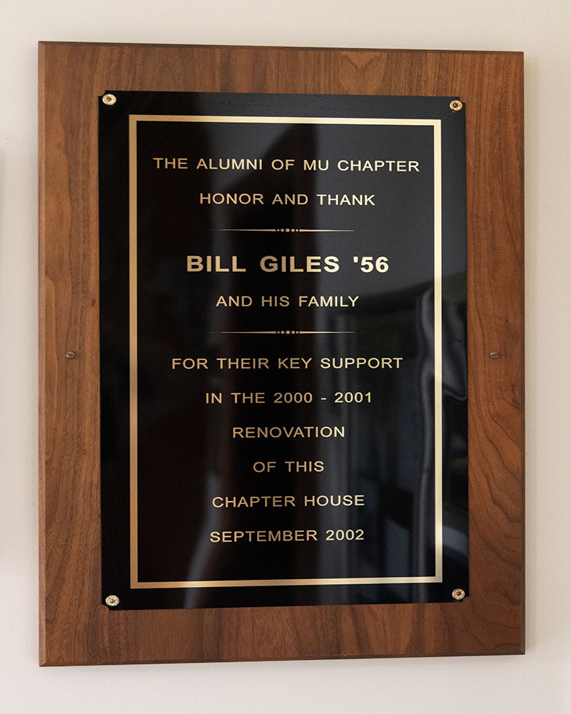 A wooden plaque honoring Bill Giles 56 and his family for their support of the 2000-2001 chapter house renovation.