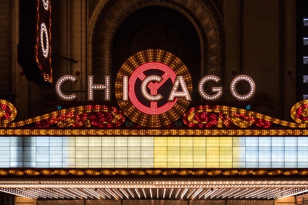 Chicago theater marquee sign lit up at night; kellyvandellen - stock.adobe.com