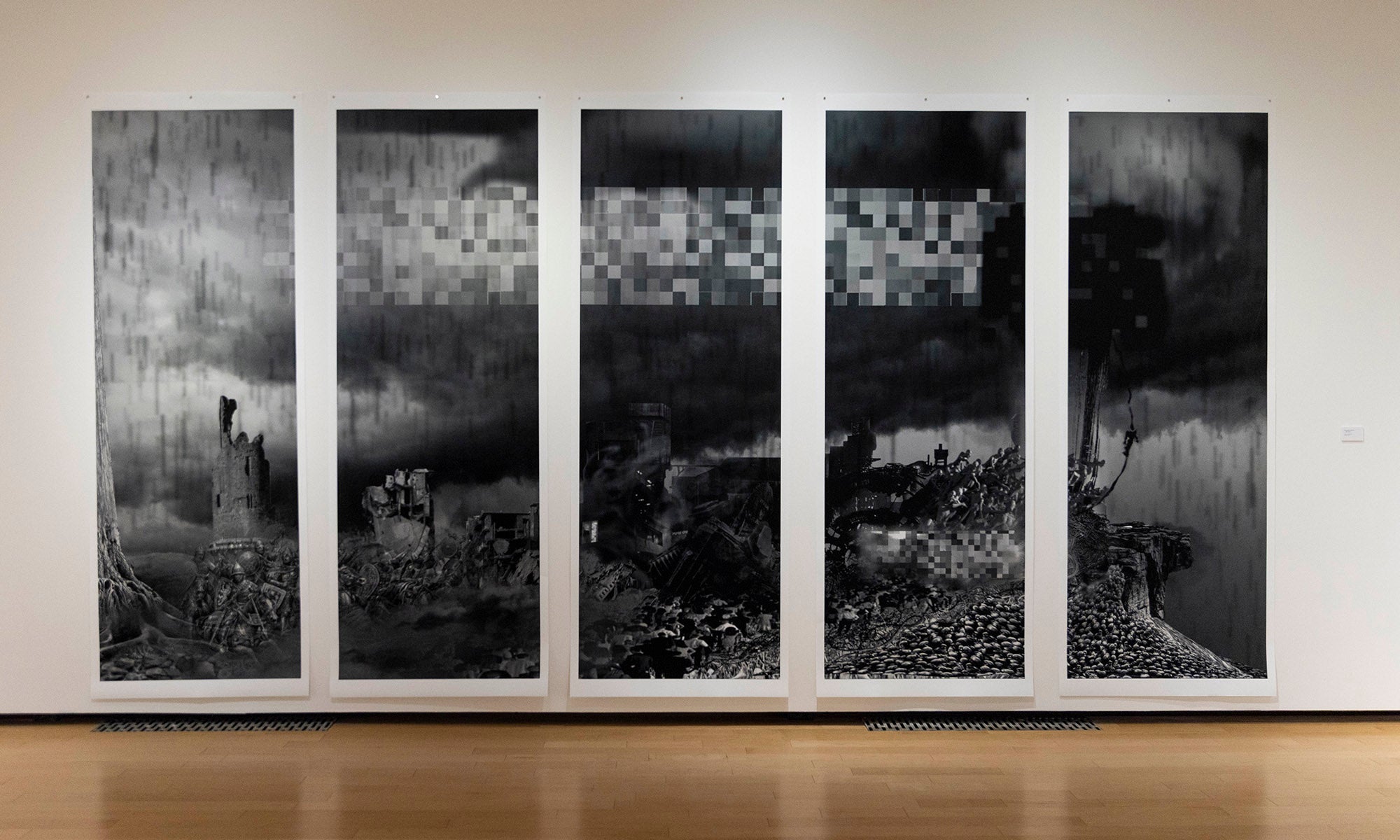 Five large vertical black and white abstract panels are displayed side by side on a gallery wall at Denison Museum, as part of the "It Was Never Just Then" exhibition, each featuring textured patterns and digital-like distortions.
