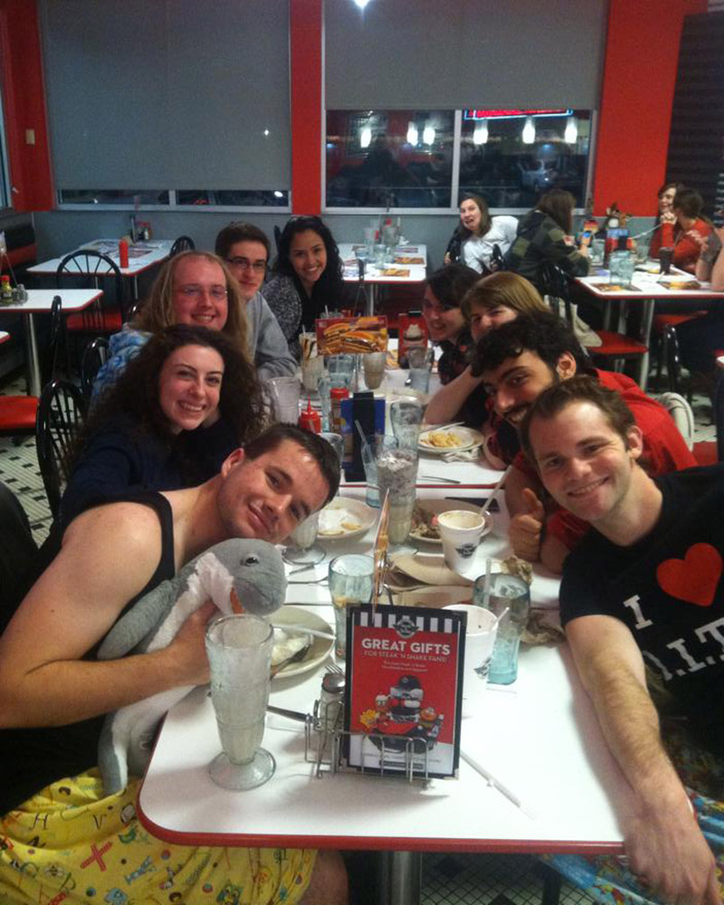 A group of friends sitting at a restaurant table.