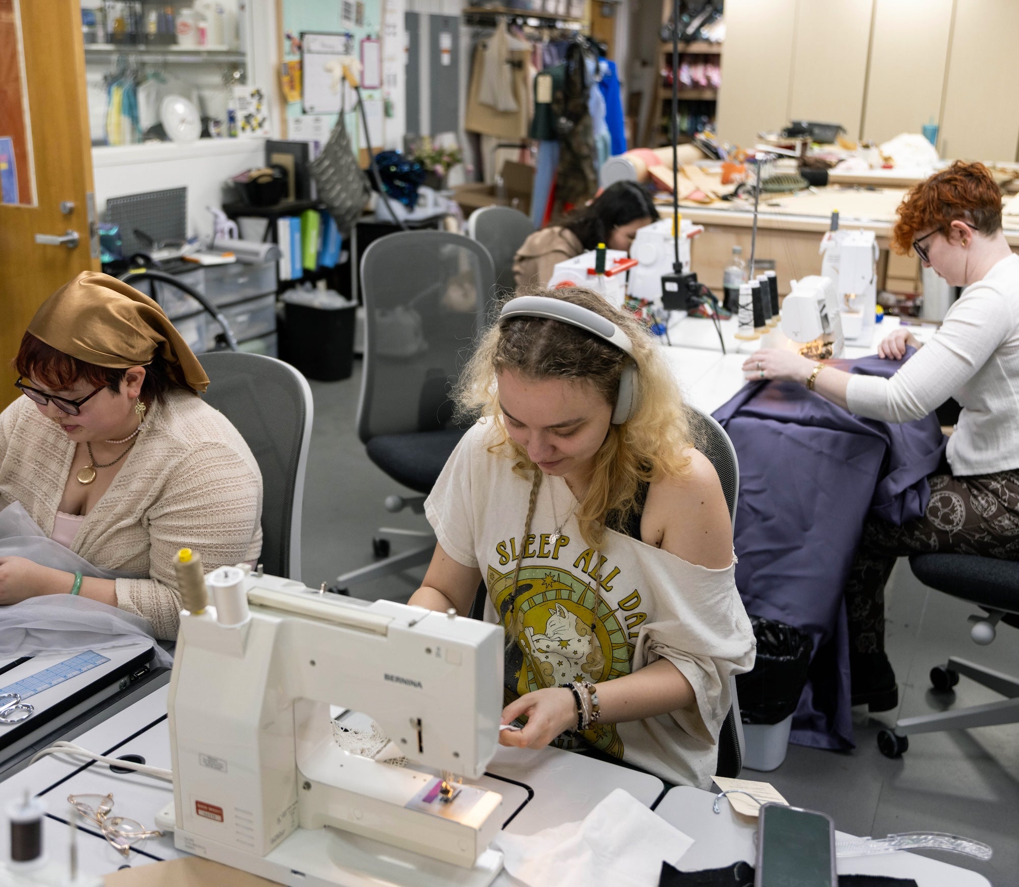 Students sewing costumes