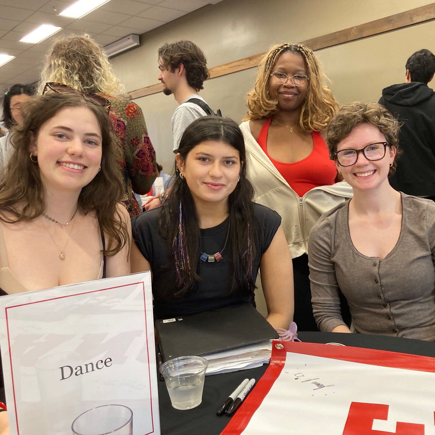 Dance major sitting at their table on Major Day.