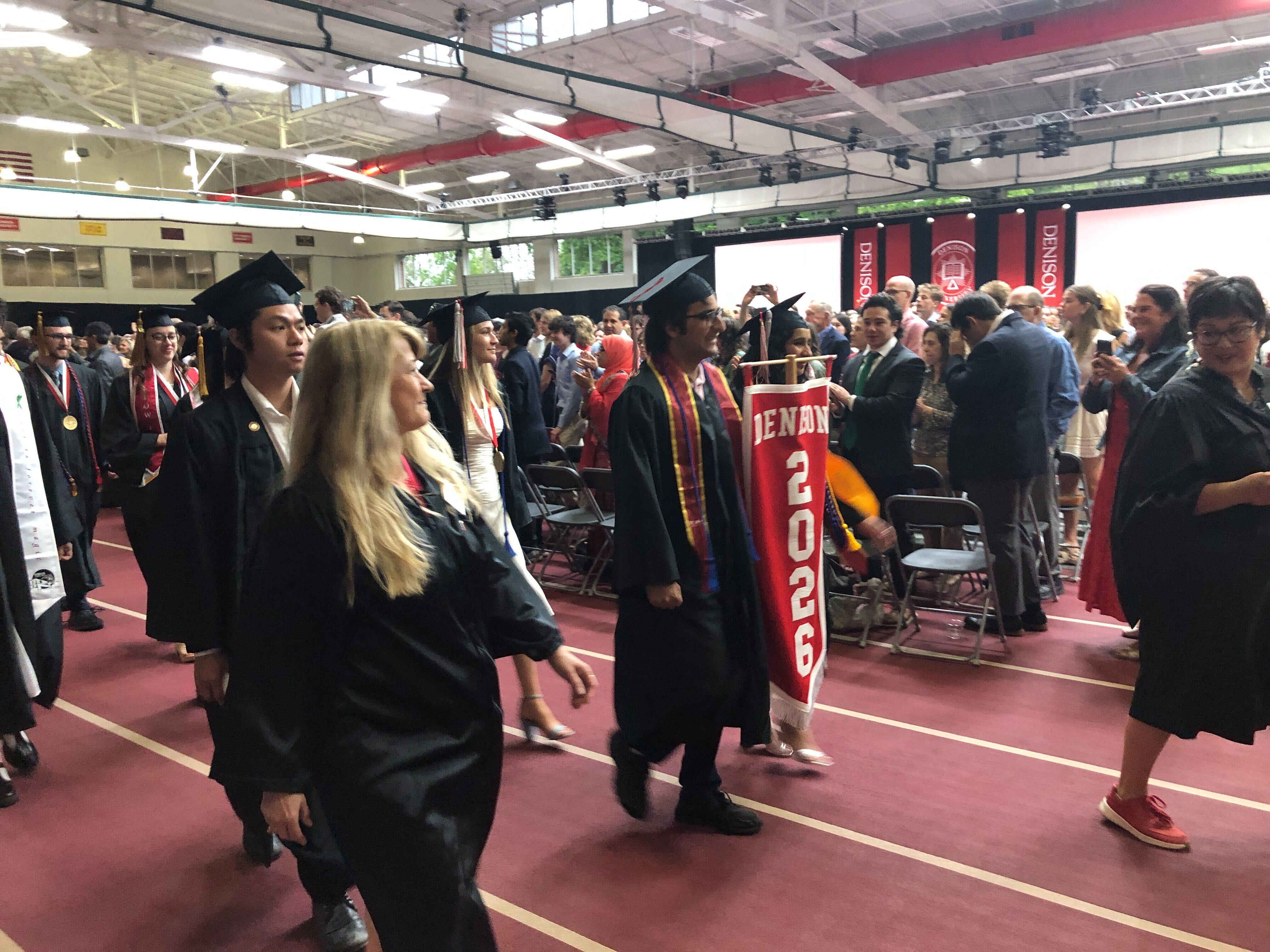 Members of the Class of 2026 enter Mitchell Fieldhouse for Commencement.