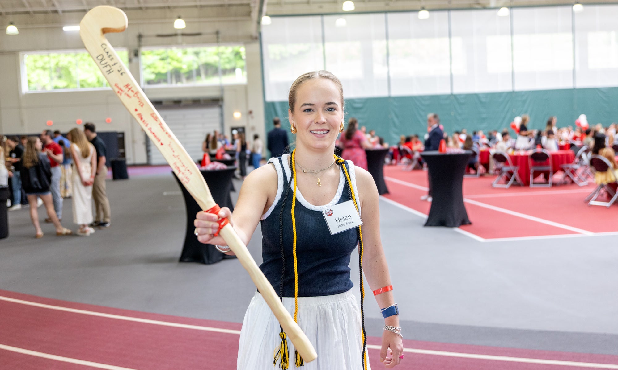 Woman with field hockey stick