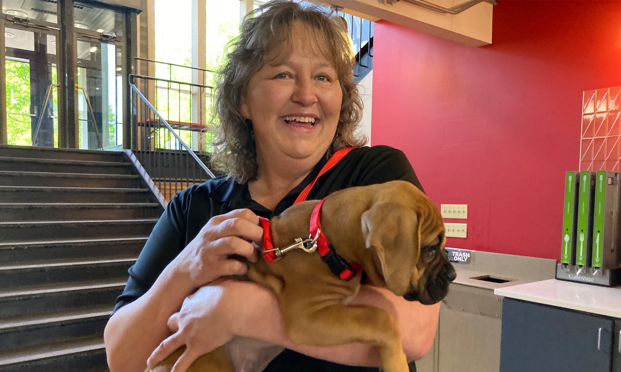 Slayter worker Tammy brought in boxer pup Chief to meet some of her favorite graduating seniors.