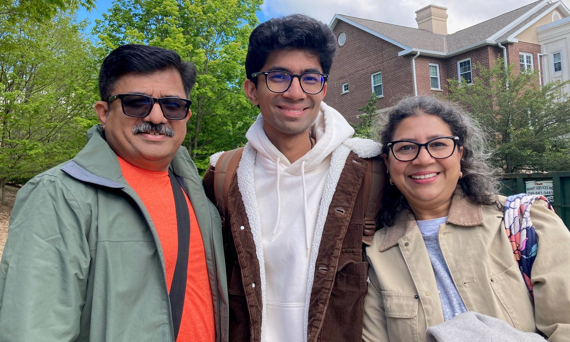 Aarnav Jagdhane '26 with his parents 