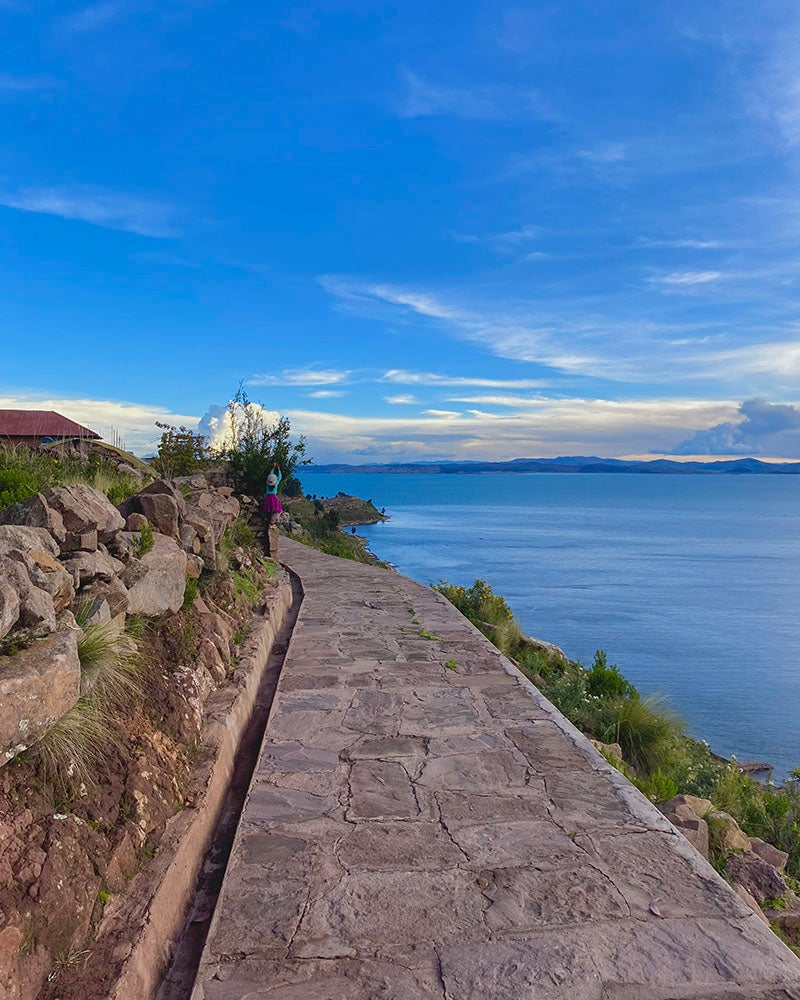 A sidewalk along a lake