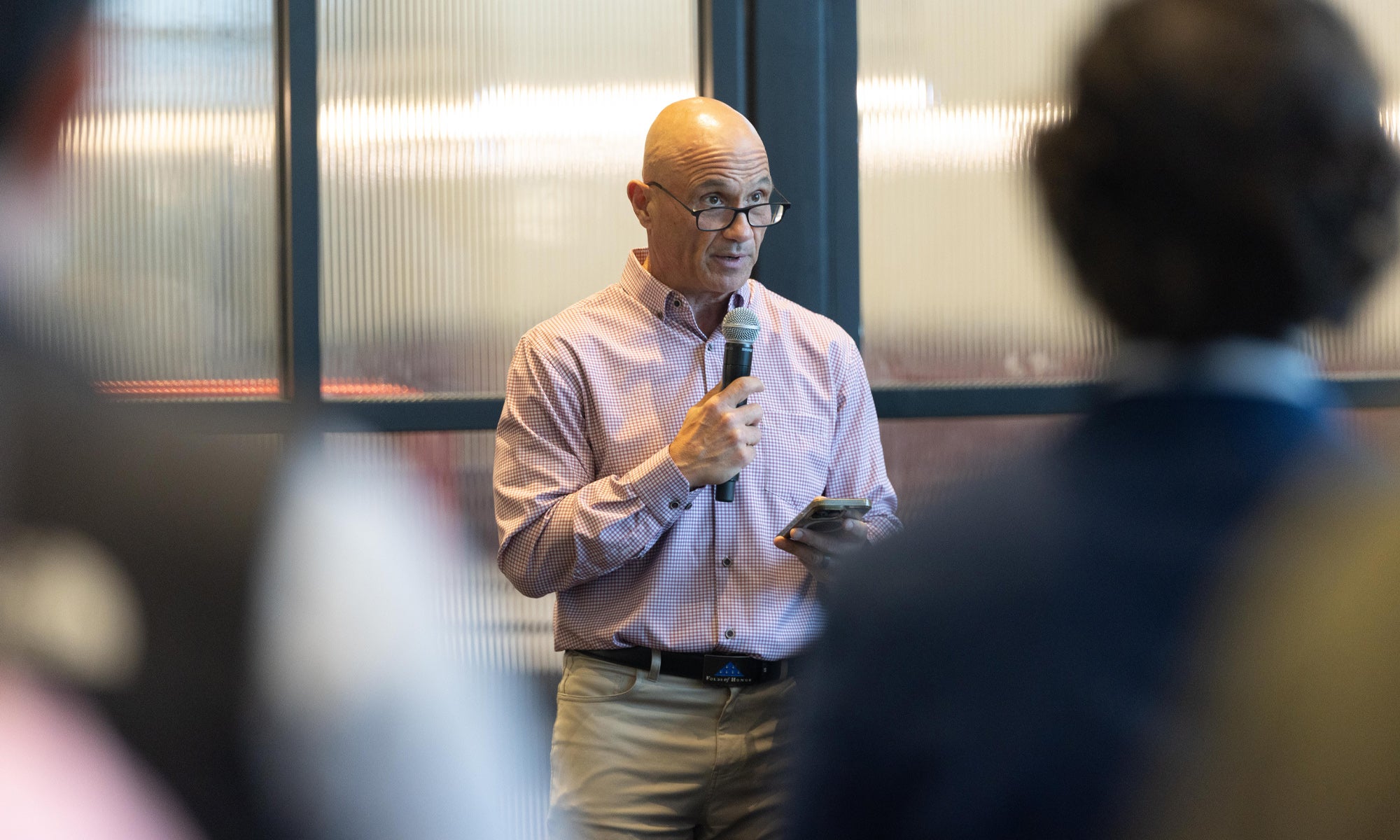 Photo of alum Chuck Bellofatto '89 speaking at an event.