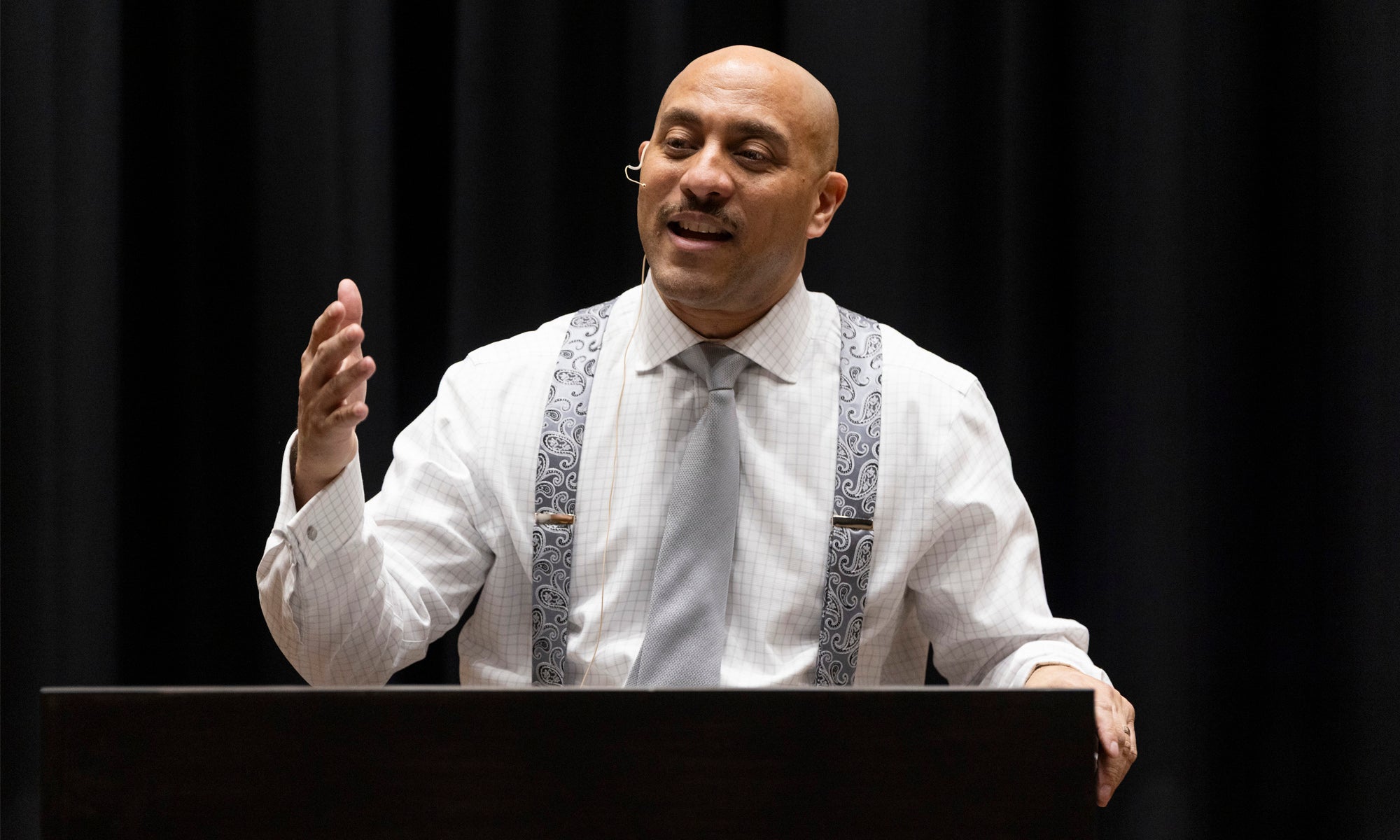 A man delivering a speech at a podium.