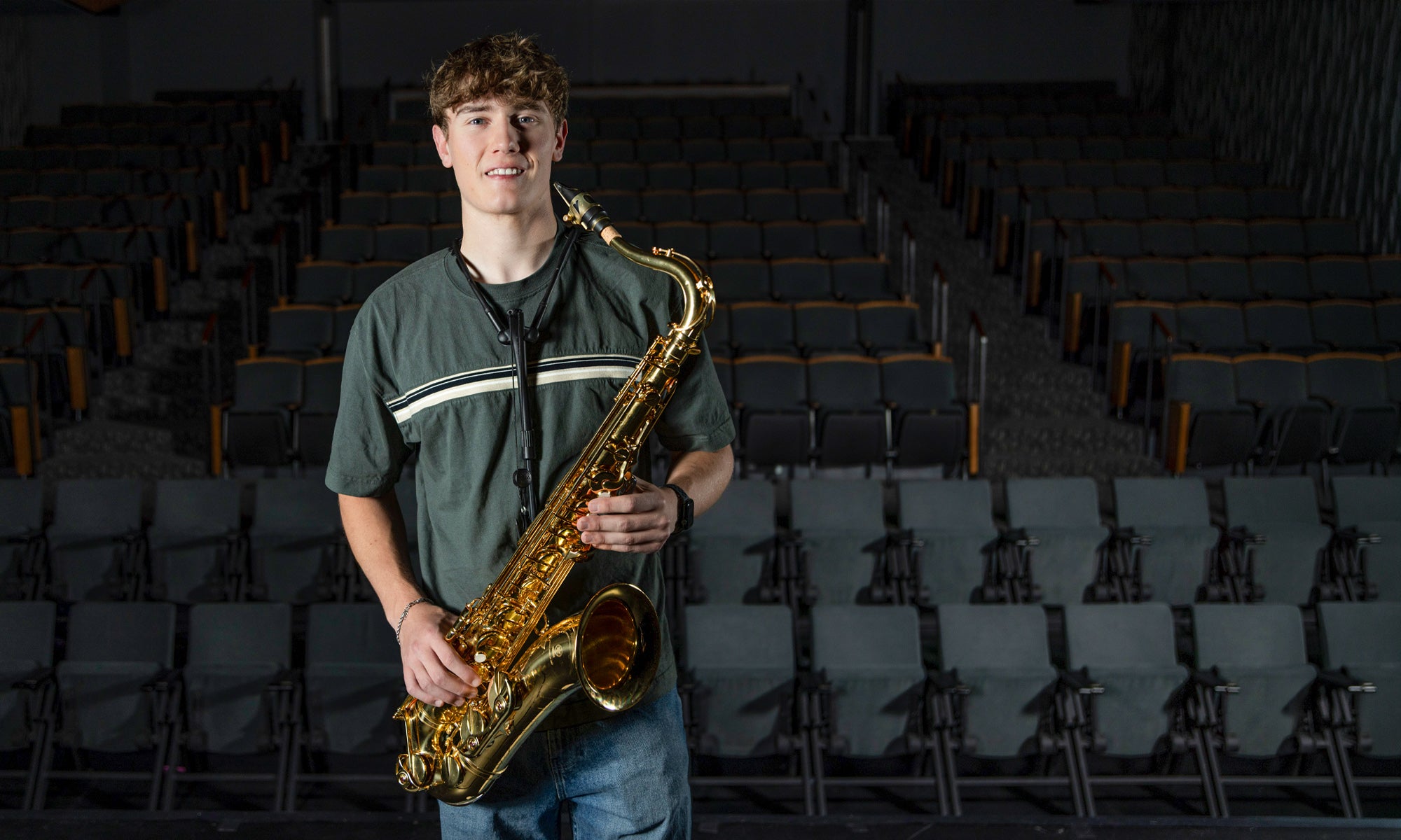 Nathan Wilson holding a saxophone