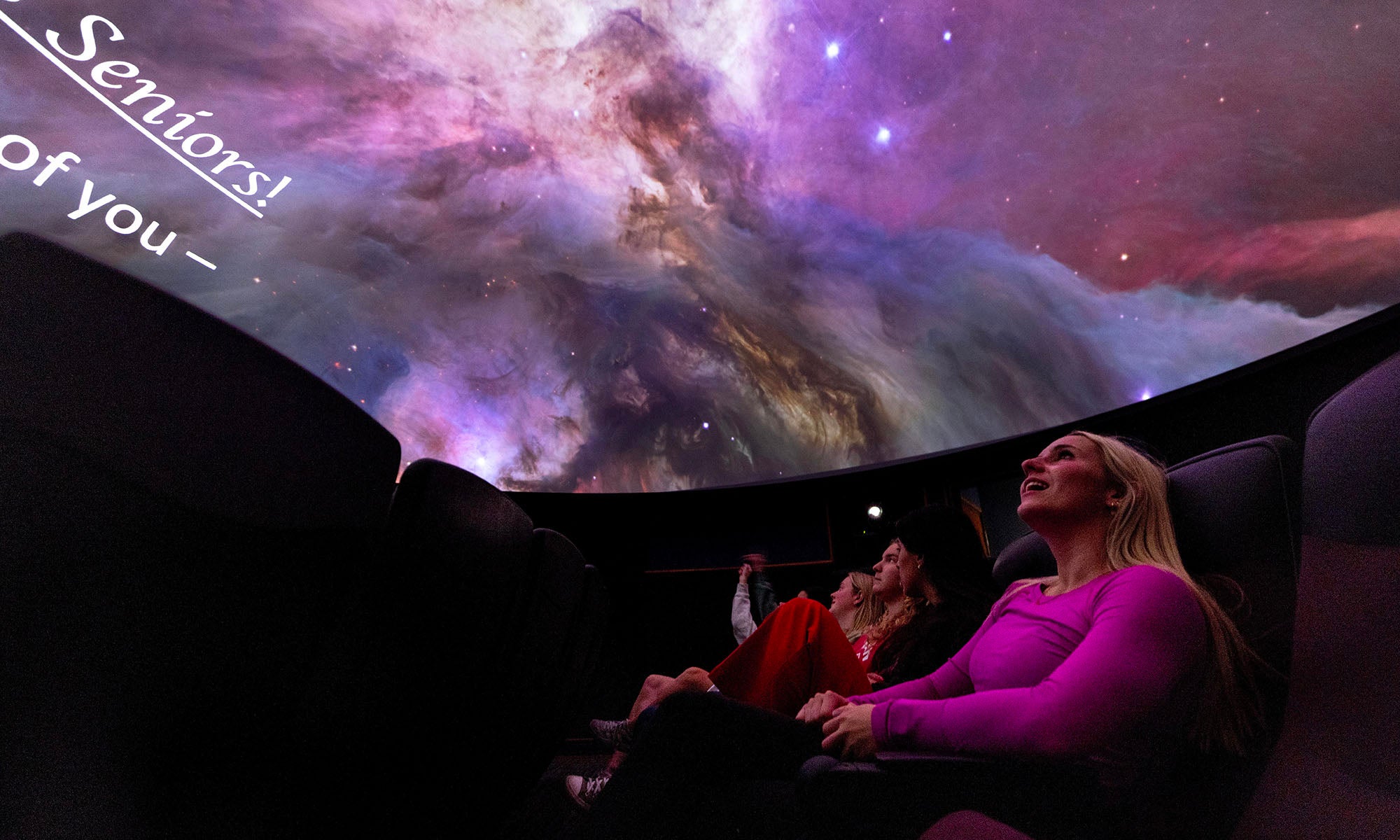 Student view a planetarium show.
