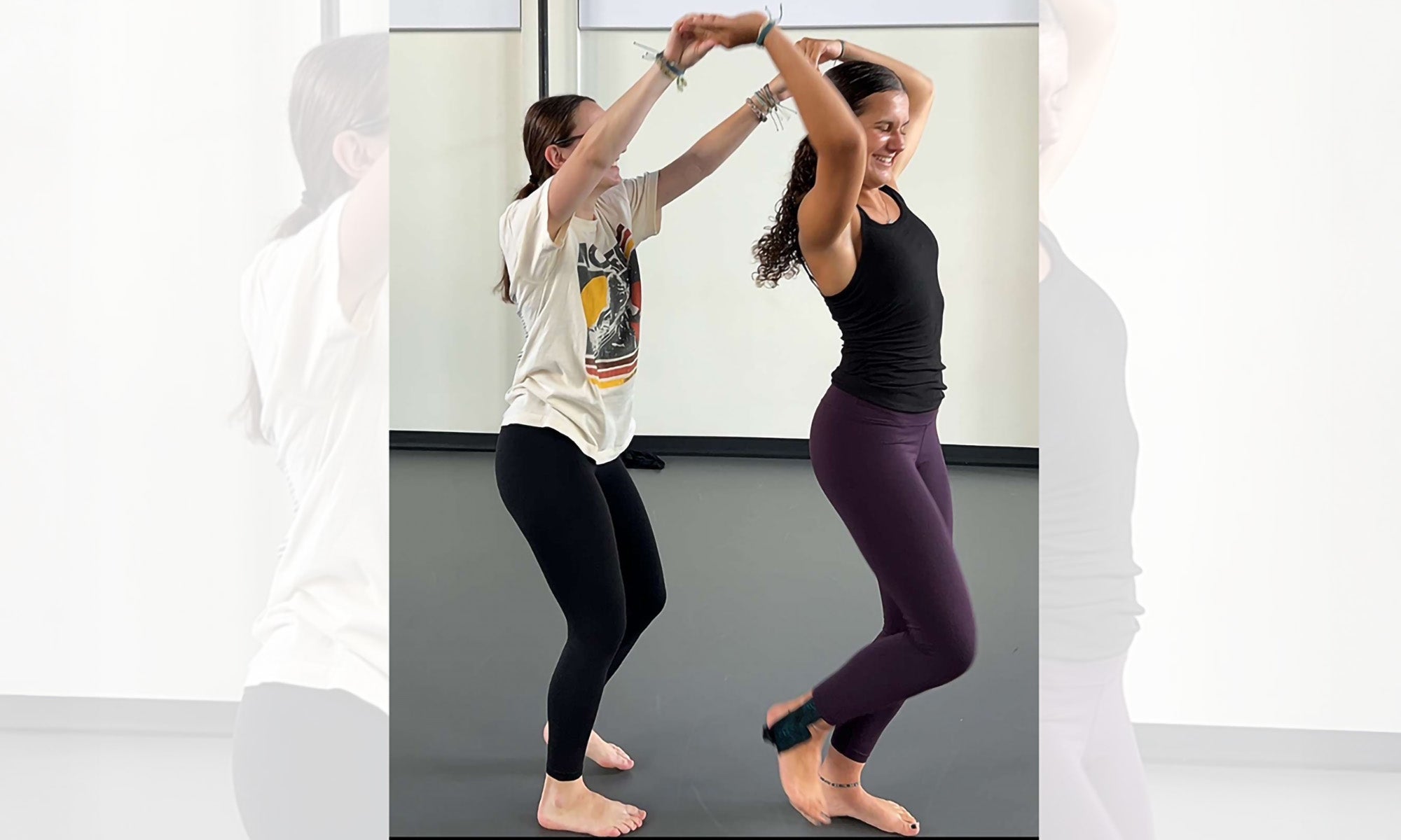 Two dancers practicing a routine.