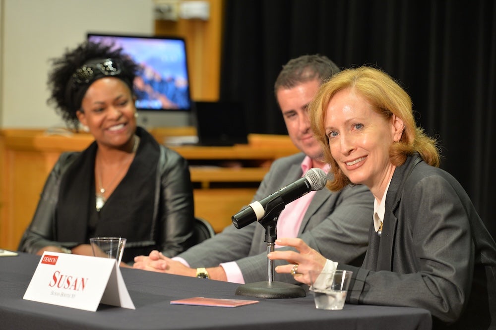 Susan Booth ’85 sits at a table