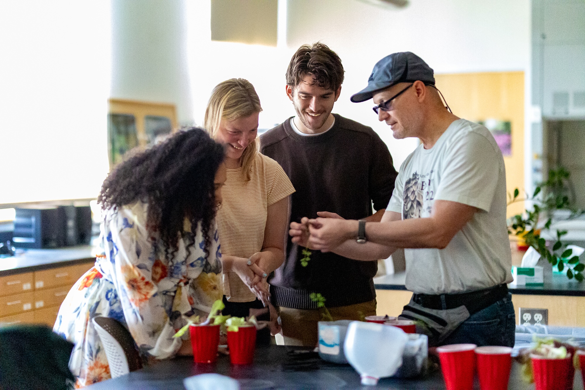 Associate Professor Warren Hauk talking with students