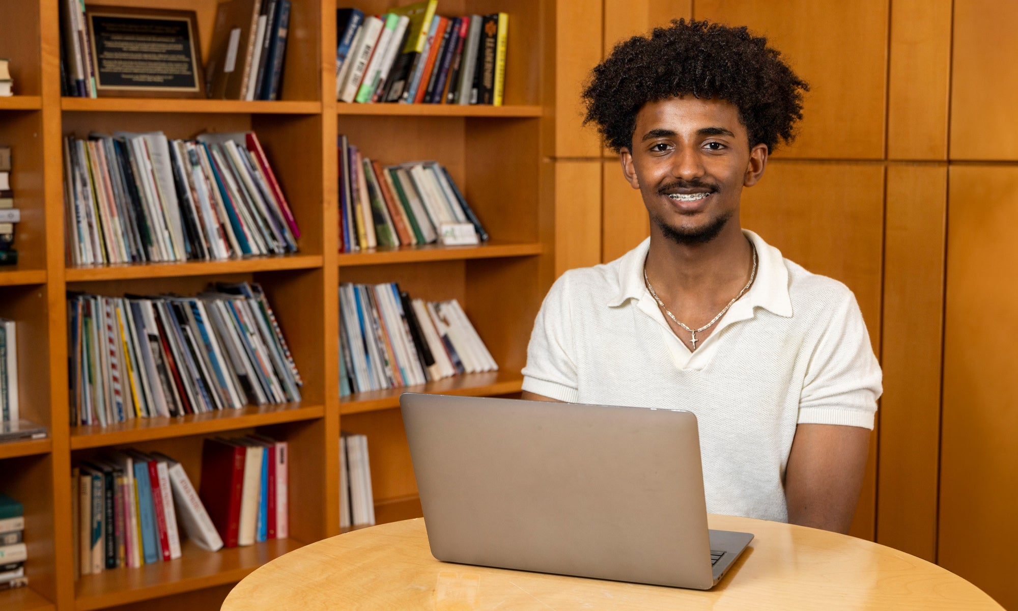 Yohannes Mulualem sitting at a laptop