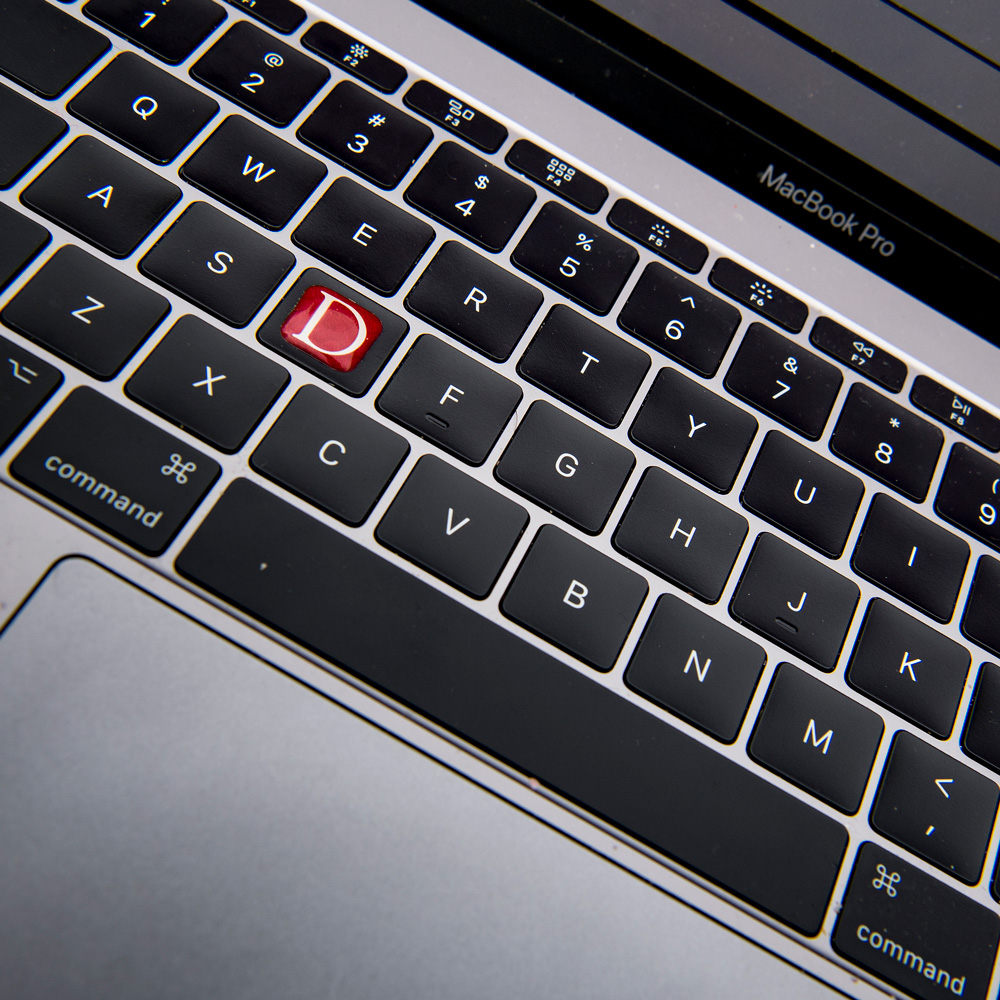 Computer keyboard with Denison D sticker
