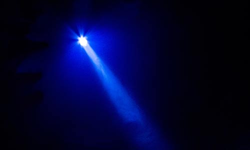 Photo of a spotlight above a stage