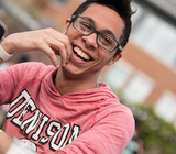Smiling student on common-DU shirt