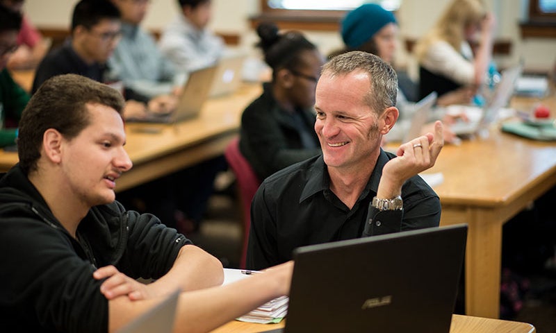people talking at desk