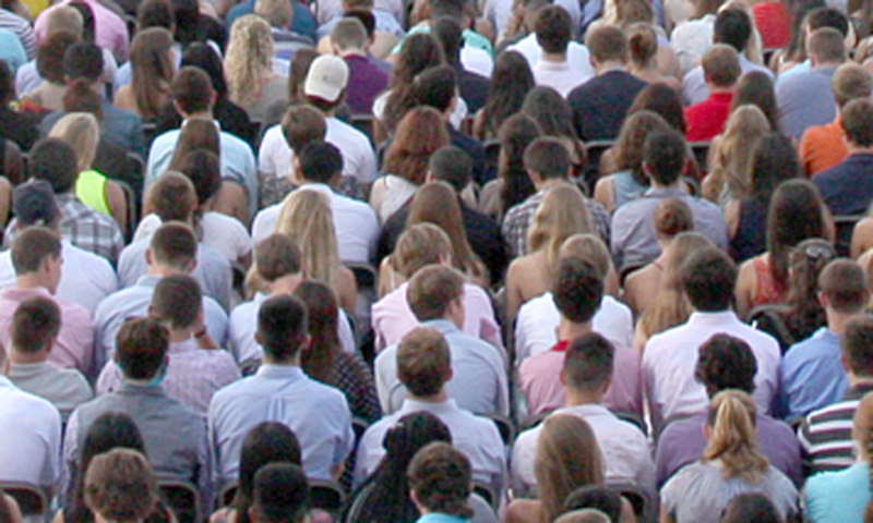 Students in crowd listening to speaker
