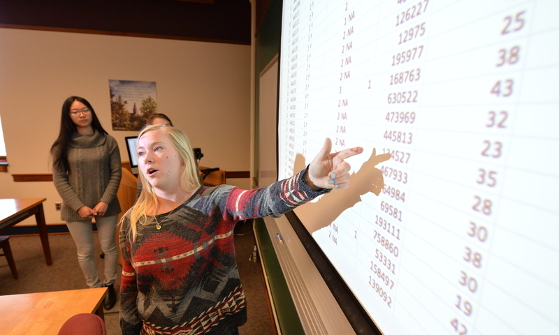 Student explaining data sheet