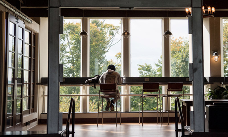 Image of student studying alone in Slayter Hall