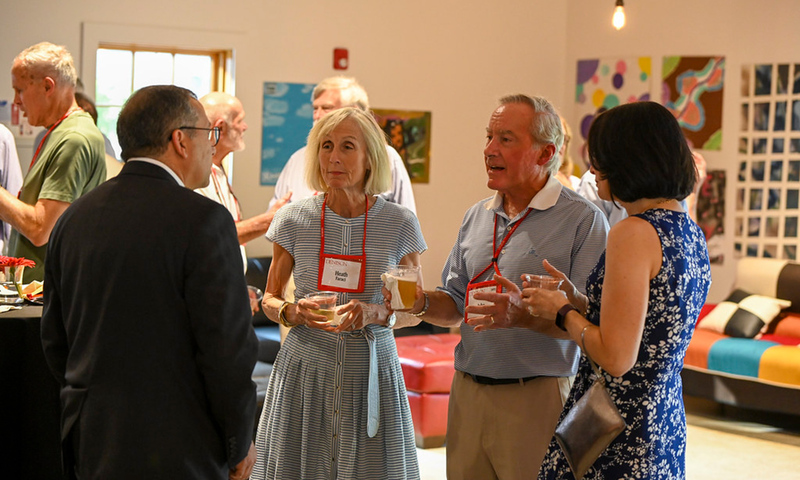 President Adam Weinberg speaks with alumni at the 2022 reunion.