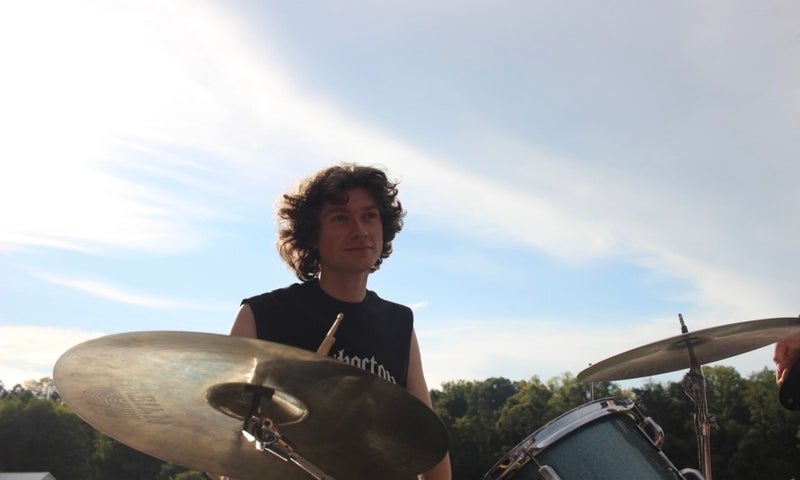 Mick Smith plays the drums.