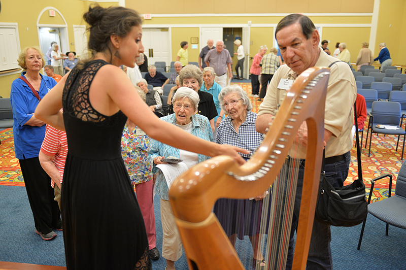 Harpist Clemente answers questions from Kendal audience.