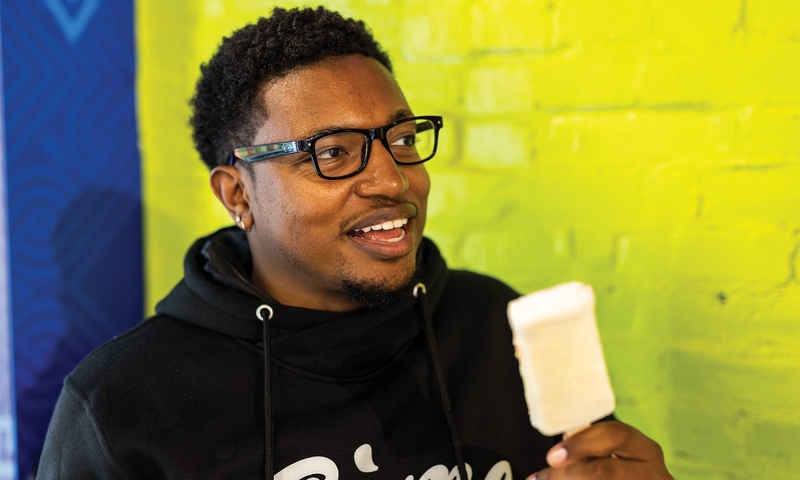 BRAIN FREEZE: Denison Social Media Manager Anthony Ledgyard cools down with a piña colada popsicle before swearing off ice cream for the near future.