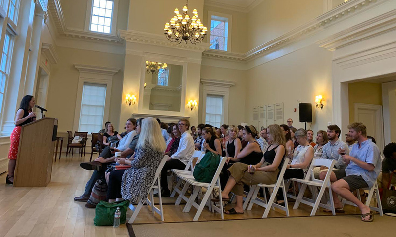 Conference Photo—Executive Editor Allison Wright recalls a week of workshops, readings, and panels at the reception concluding the Writers' Conference. 