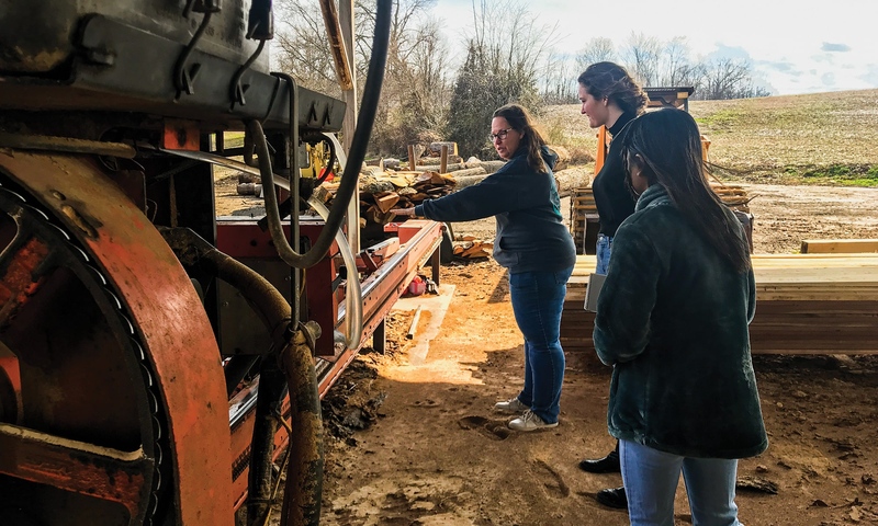 ON ASSIGNMENT: Boirard and Jen Clancey ’23 tour Sand and Sip Rustic Wood Workshop in Johnstown, Ohio, with one of its owners, Amy Kent.