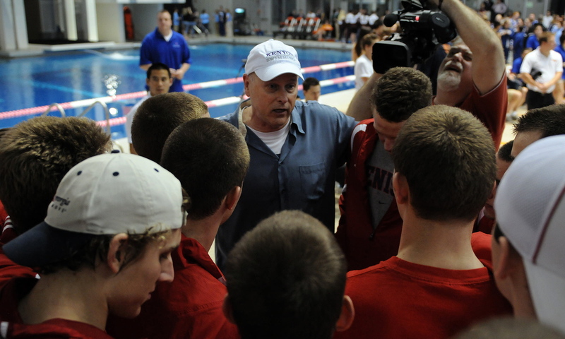 Kenyon coach Jim Steen congratulates the Denison swim team after the Big Red won the NCAA Division III title.
