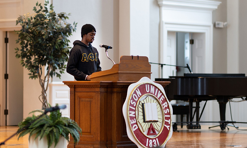 Micah Arnold ’22 introduces the Martin Luther King Jr. Celebration keynote speaker, the Rev. Dr. Victor Anderson.
