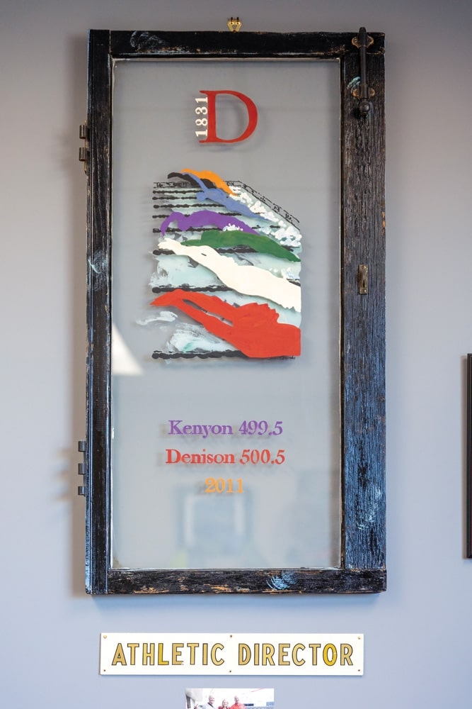 A painted window that celebrates the men’s first NCAA swimming championship in 2011