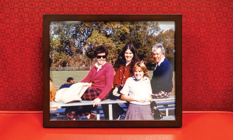 The photograph of her family in the bleachers after a field hockey game — parents clad in plaid, fresh off a round at the Denison Golf Club, older sister sprouting a pair of bunny ears behind Carney-DeBord’s head.