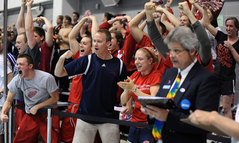 Denison men’s and women’s swimmers cheer Al Weik to a win in the 1650-meter final. Weik’s time of 15:06.47 set a national record.