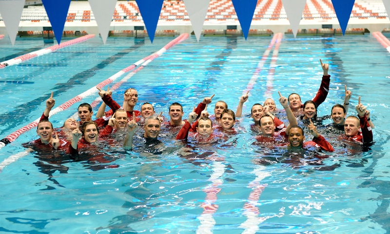 In keeping with tradition, the newly-crowned national champions dove into the pool for a celebration photo. Coach Gregg Parini said, “I remember for weeks walking down the street and catching myself smiling. It was just a great sense of satisfaction.”
