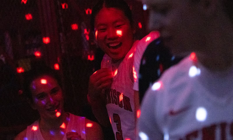 Women's Basketball team doing pre-game ritual.