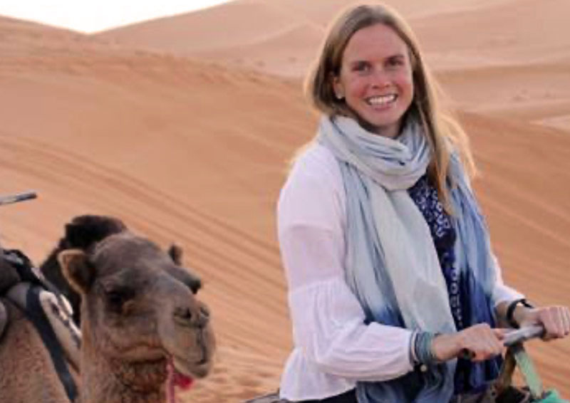 Chloe Rekow riding a camel