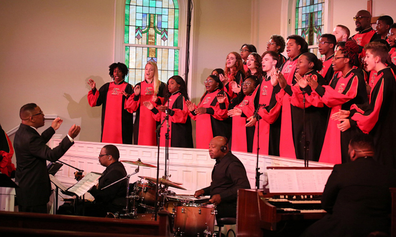Raymond Wise, left, conducts the IU African American Choral Ensemble. Photo courtesy of the African American Arts Institute