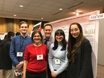 Students and recent alumni at a conference with Associate Professor of Chemistry Rachel Mitton-Fry