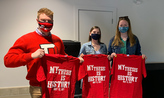 Senior student researchers with t-shirts that read "My research is history"