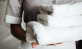 Hotel maid changing towels