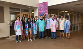 researchers and faculty sport tie dyed lab coats