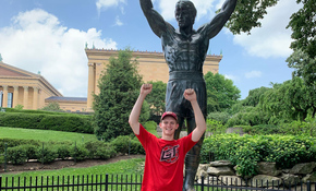 Benny Mandelbrot in Philadelphia posing in front of statue
