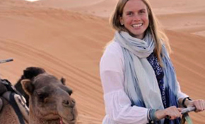 Chloe Rekow riding a camel