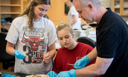 Prof. Eric Winters in a lab with students