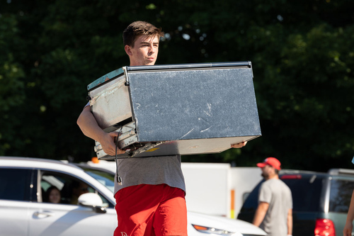 Denison football players helped lighten the load on a warm Move-In morning.