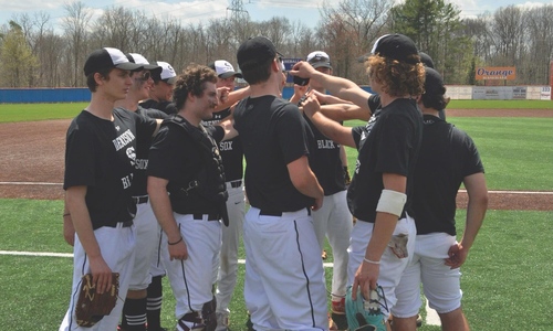 Denison Baseball Players in a Huddle